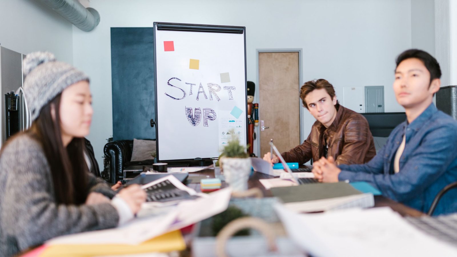 A small startup team working through a plan together